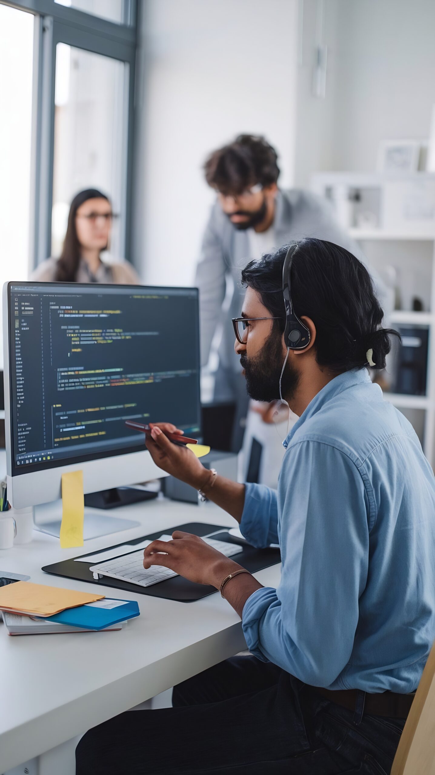 diverse-office-indian-it-programmer-working-desktop-computer