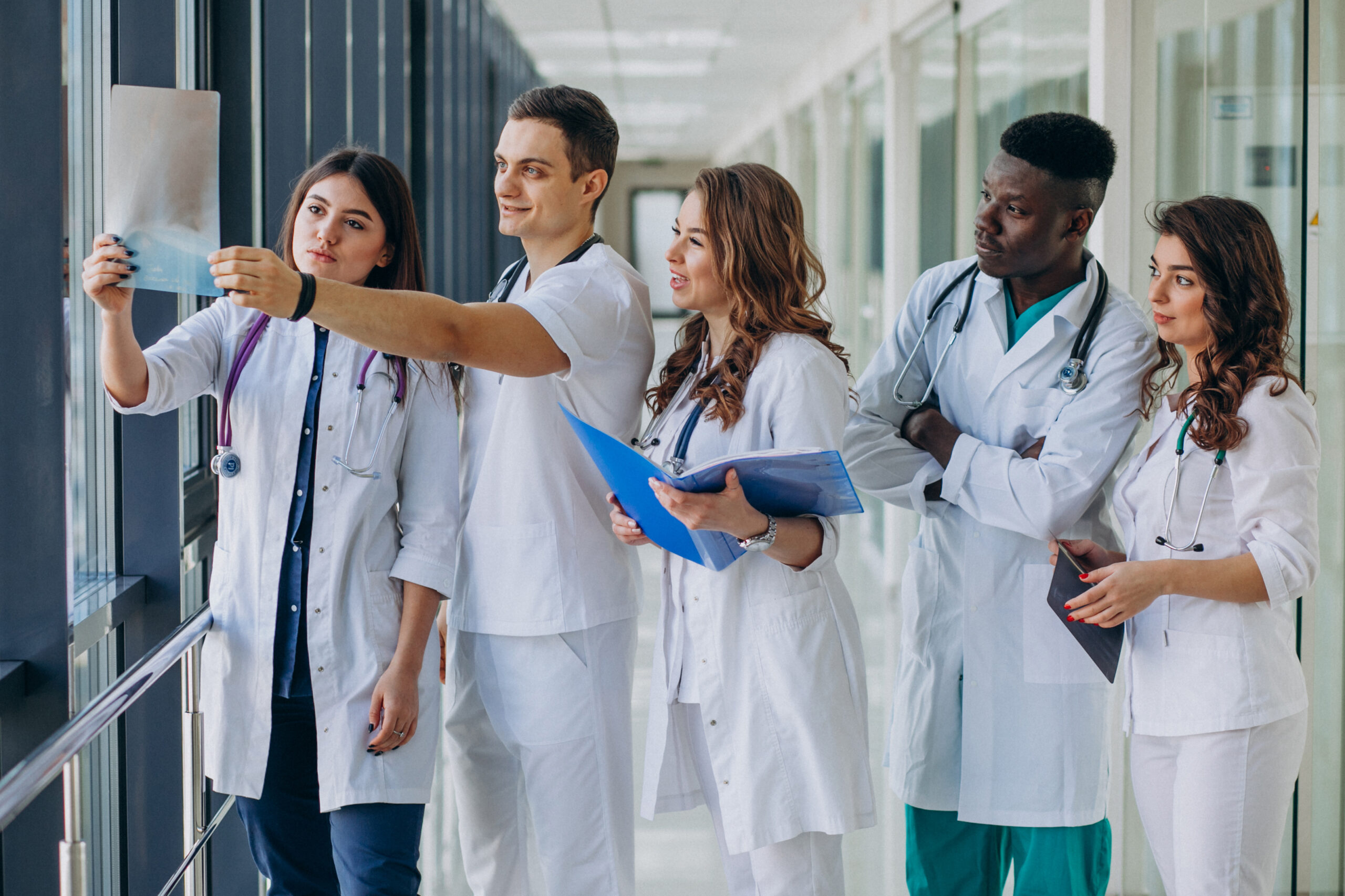 team-young-specialist-doctors-standing-corridor-hospital