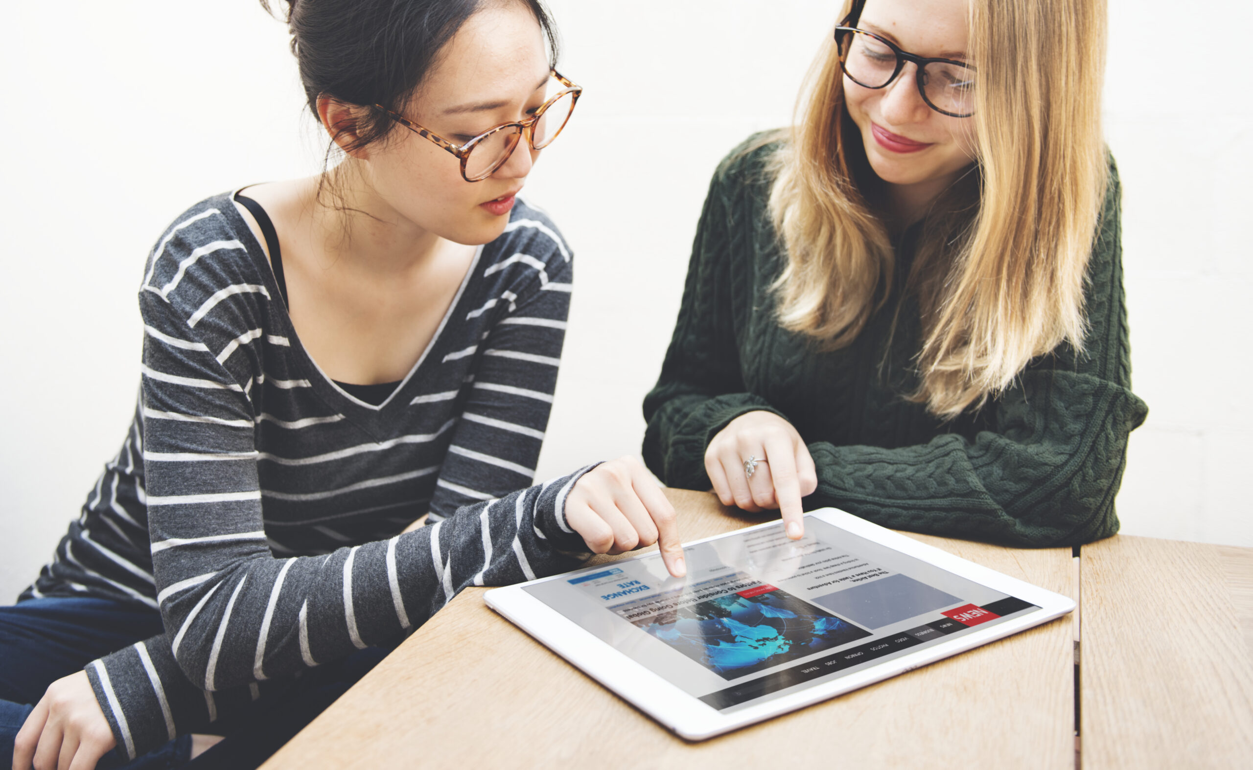 Women Friendship Digital Tablet News Networking Concept