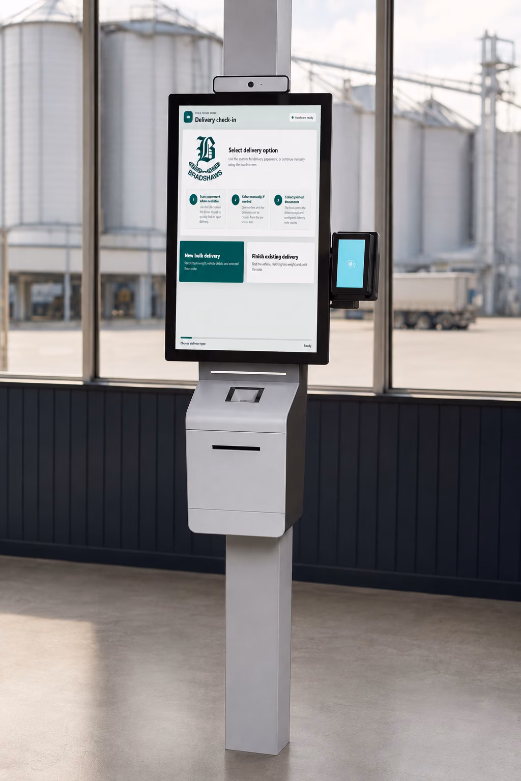 MillInsight Delivery Kiosk hardware mock-up MillInsight delivery check-in software on a freestanding touch-screen kiosk in an illustrative flour mill dispatch setting