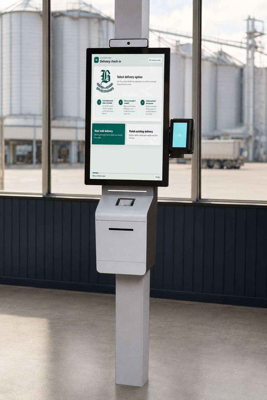 MillInsight Delivery Kiosk hardware mock-up MillInsight delivery check-in software on a freestanding touch-screen kiosk in an illustrative flour mill dispatch setting